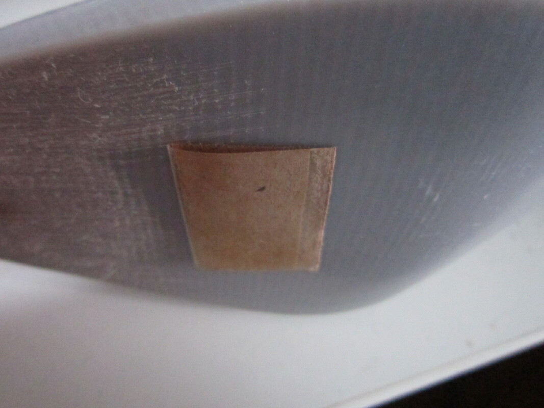 Adhesive element in flat folded position